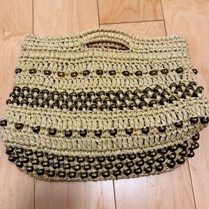 Handwoven bag with metal bead detail